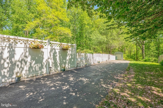 exterior space with an outdoor structure and fence