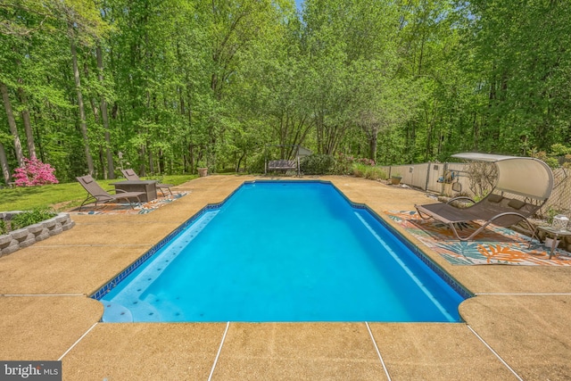 pool featuring a patio area