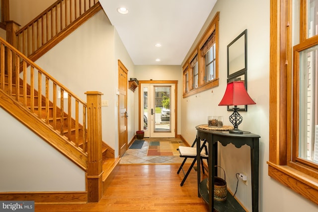 entryway with stairs, recessed lighting, baseboards, and light wood-type flooring