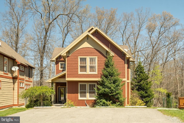view of front of house featuring board and batten siding and driveway