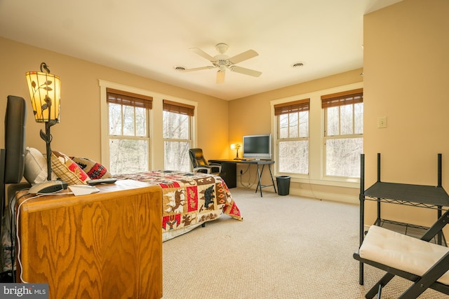 bedroom featuring visible vents, carpet, and ceiling fan