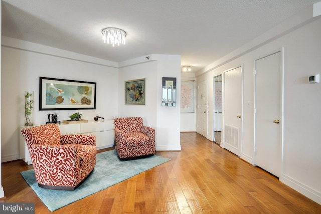 900 Stafford St N Unit 2222, Arlington, VA 22203 - living area featuring hardwood / wood-style floors, visible vents, and baseboards