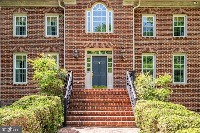 entrance to property with brick siding