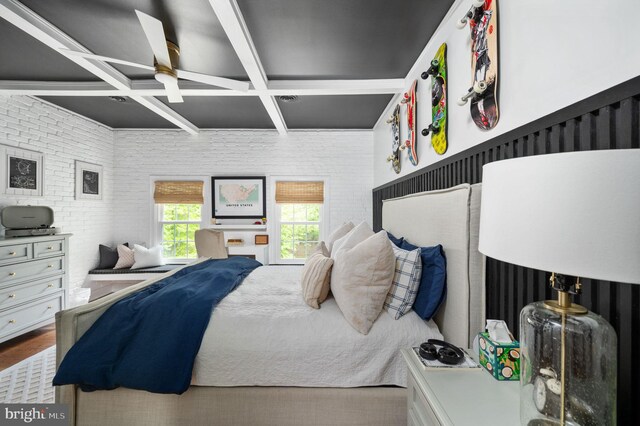 bedroom with beamed ceiling and coffered ceiling