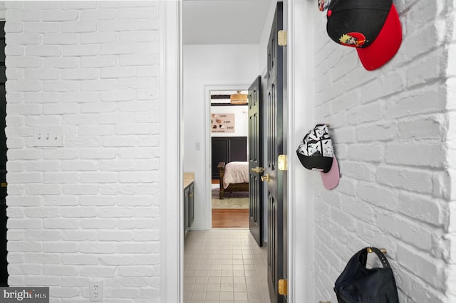 hall featuring light tile patterned floors