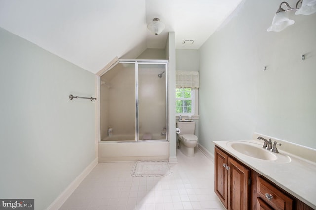 bathroom featuring vanity, toilet, baseboards, vaulted ceiling, and visible vents