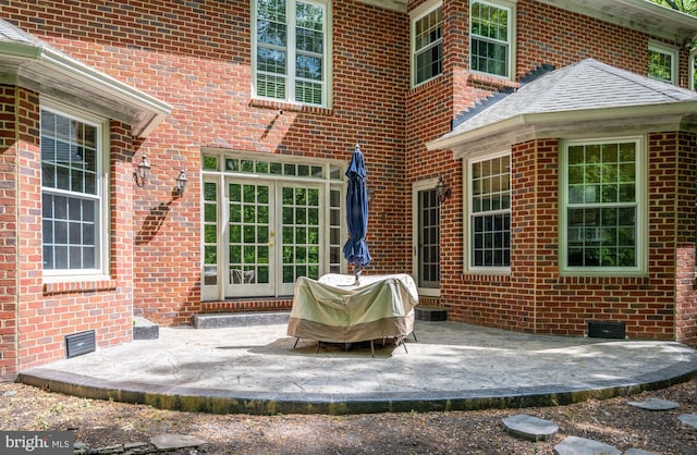 view of patio with visible vents, french doors, and a grill