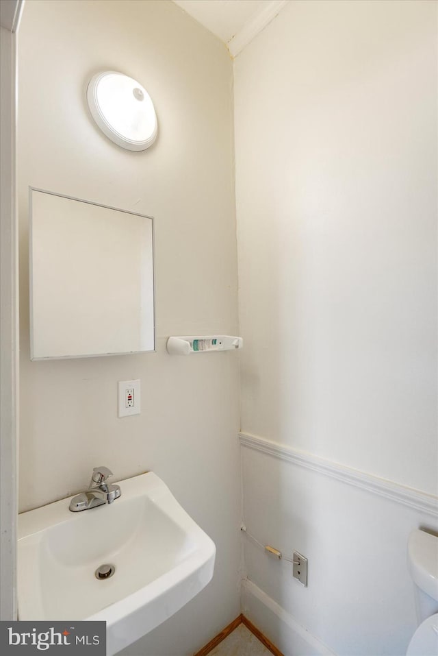 bathroom with a sink and toilet