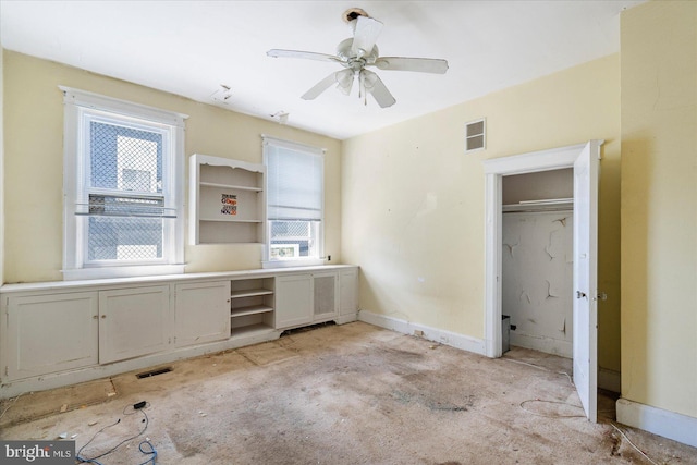 unfurnished bedroom with visible vents, light carpet, and multiple windows