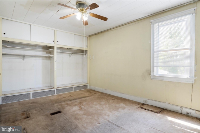 unfurnished bedroom with ceiling fan, visible vents, and a closet