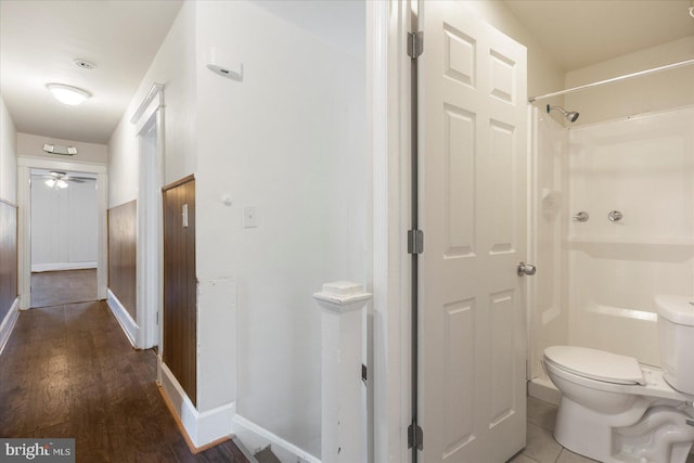 interior space with baseboards and wood finished floors