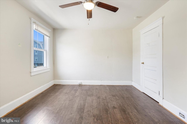 unfurnished room with a ceiling fan, baseboards, and wood finished floors
