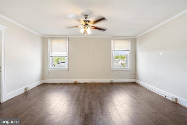 spare room with crown molding, ceiling fan, dark wood-style floors, and a healthy amount of sunlight
