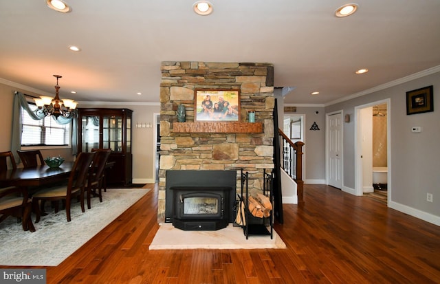 living area with an inviting chandelier, wood finished floors, crown molding, and recessed lighting