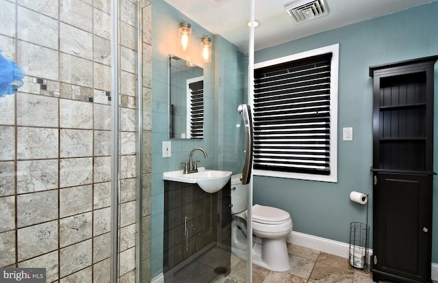 full bath featuring a sink, visible vents, baseboards, toilet, and tile patterned flooring