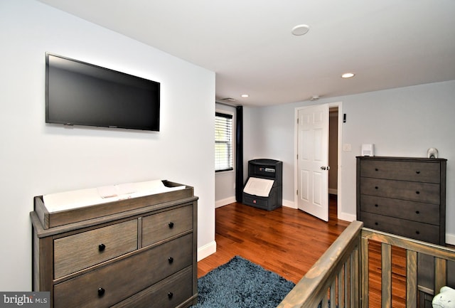 bedroom featuring dark wood-type flooring, recessed lighting, and baseboards