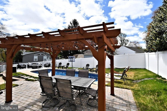 view of patio / terrace with outdoor lounge area, a fenced in pool, a pergola, and a fenced backyard