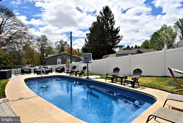 view of swimming pool featuring an outdoor living space, a fenced in pool, a fenced backyard, and a patio area