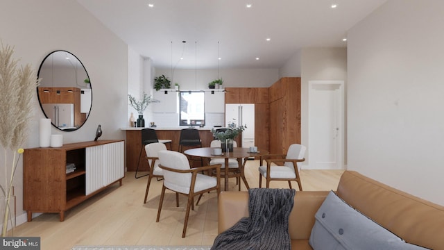 dining space with recessed lighting, radiator heating unit, and light wood-style floors