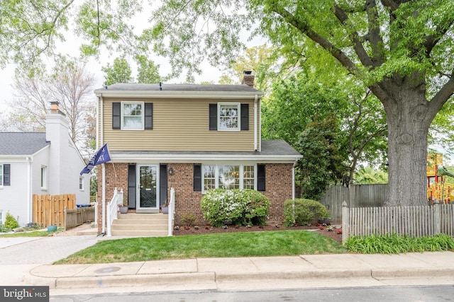 403 Thomas St, Alexandria, VA 22302 - view of front of property featuring fence, a chimney, and brick siding