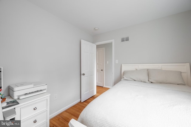 403 Thomas St, Alexandria, VA 22302 - bedroom with baseboards, visible vents, and light wood-style floors