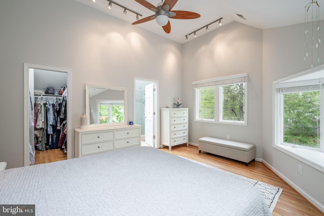 403 Thomas St, Alexandria, VA 22302 - bedroom featuring a walk in closet, multiple windows, and rail lighting