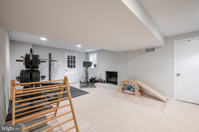 403 Thomas St, Alexandria, VA 22302 - workout room with visible vents, a brick fireplace, baseboards, carpet, and recessed lighting