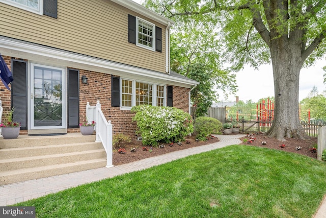 403 Thomas St, Alexandria, VA 22302 - exterior space featuring fence, a yard, and brick siding