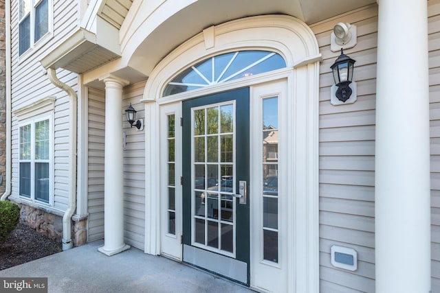 doorway to property featuring stone siding