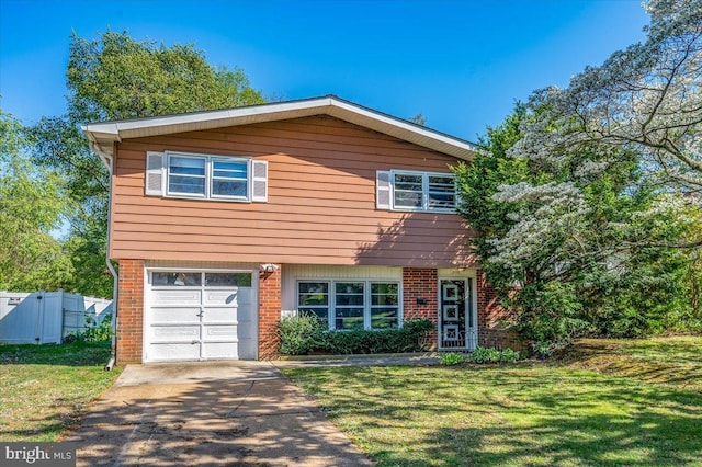 view of front facade featuring a garage, brick siding, driveway, and a front yard