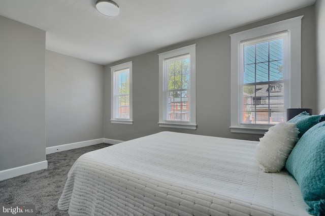 carpeted bedroom with baseboards