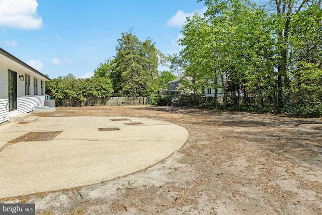 view of yard featuring a patio area and fence