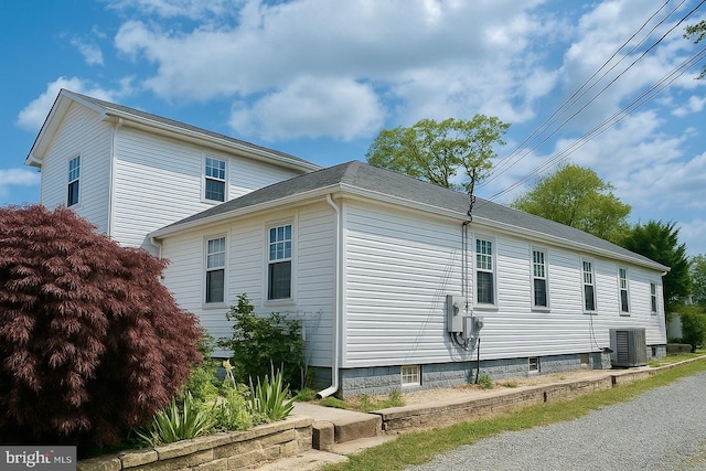 view of home's exterior with cooling unit