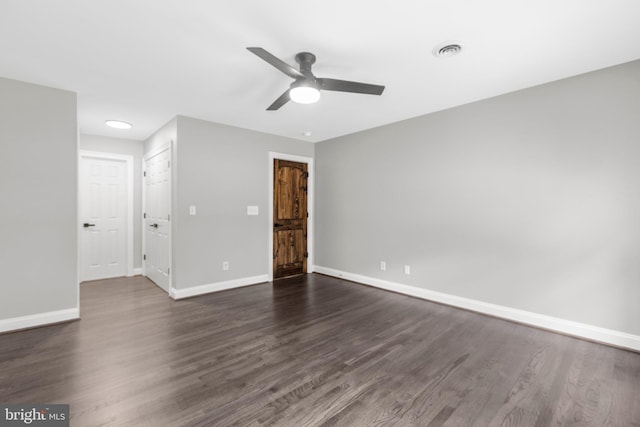 unfurnished bedroom with baseboards, dark wood-style flooring, and ceiling fan