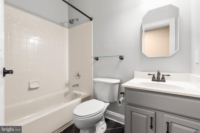 full bathroom featuring baseboards, vanity, toilet, and  shower combination
