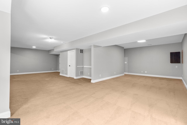 finished basement featuring carpet flooring, baseboards, and recessed lighting