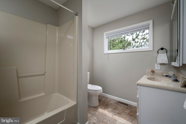 1105 N Bay Shore Dr, Milton, DE 19968 - full bath with toilet, baseboards, vanity, and shower / washtub combination