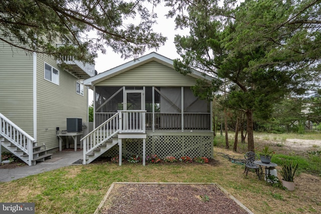1105 N Bay Shore Dr, Milton, DE 19968 - back of house with stairway, a sunroom, a garden, and central AC unit