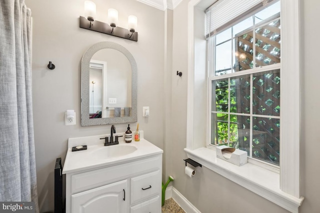 bathroom with vanity and baseboards