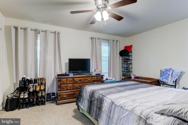 carpeted bedroom featuring a ceiling fan