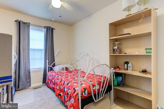 bedroom featuring carpet flooring, ceiling fan, visible vents, and baseboards