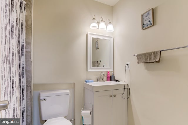 full bath featuring toilet and vanity