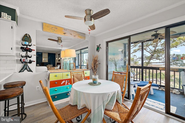 119 Old Landing Rd Unit 205A, Ocean City, MD 21842 - dining area with ceiling fan, ornamental molding, and wood finished floors
