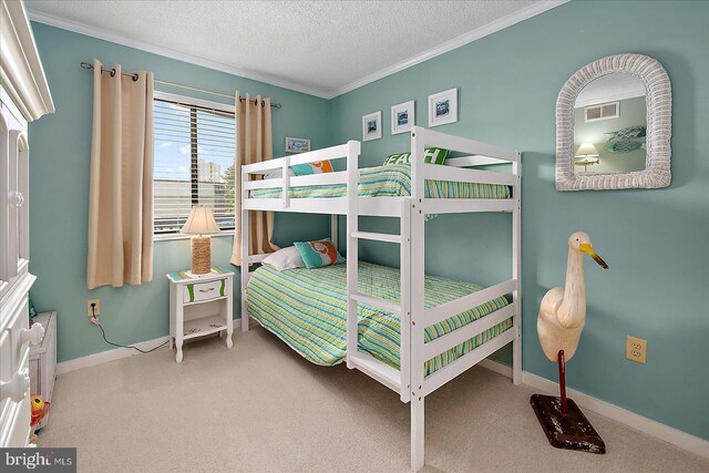 119 Old Landing Rd Unit 205A, Ocean City, MD 21842 - bedroom featuring a textured ceiling, carpet floors, crown molding, and baseboards