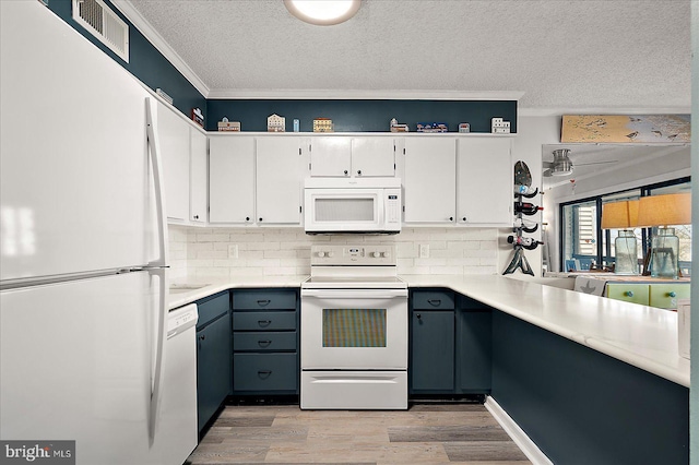 119 Old Landing Rd Unit 205A, Ocean City, MD 21842 - kitchen with white appliances, a textured ceiling, light wood-style flooring, decorative backsplash, and ornamental molding