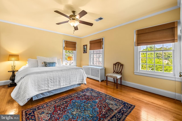508 Hampton Ln, Baltimore, MD 21286 - bedroom featuring crown molding, baseboards, wood finished floors, a ceiling fan, and radiator heating unit