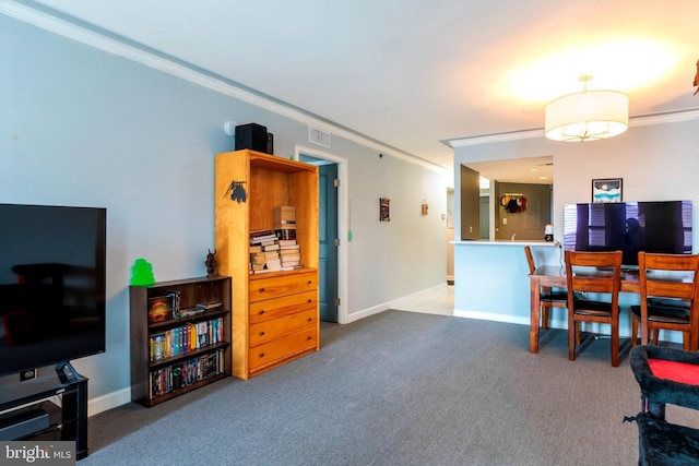 interior space with crown molding, baseboards, visible vents, and carpet floors