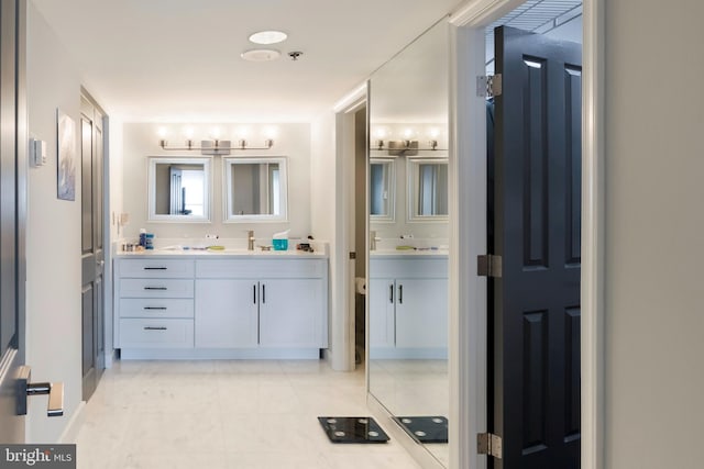 full bathroom featuring vanity, tile patterned floors, and toilet