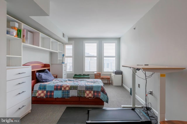 bedroom featuring baseboards, carpet flooring, and visible vents