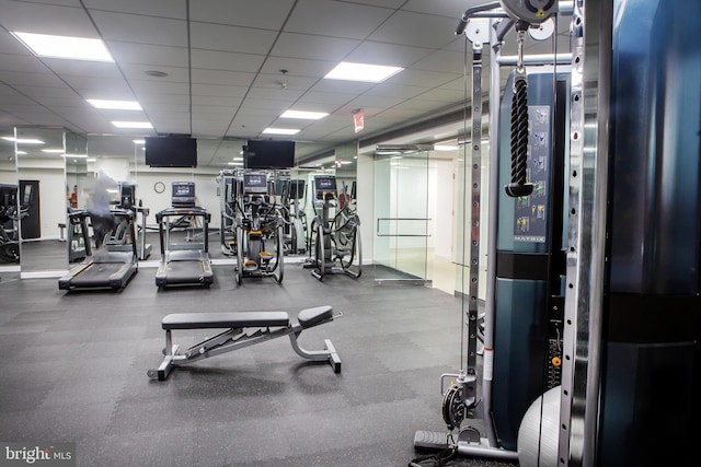 exercise room with a drop ceiling